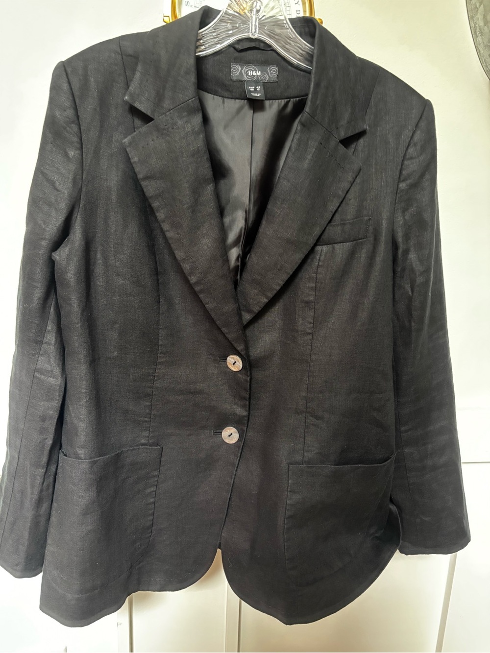 H&M linen-blend blazer jacket featuring a single-breasted two-button closure,